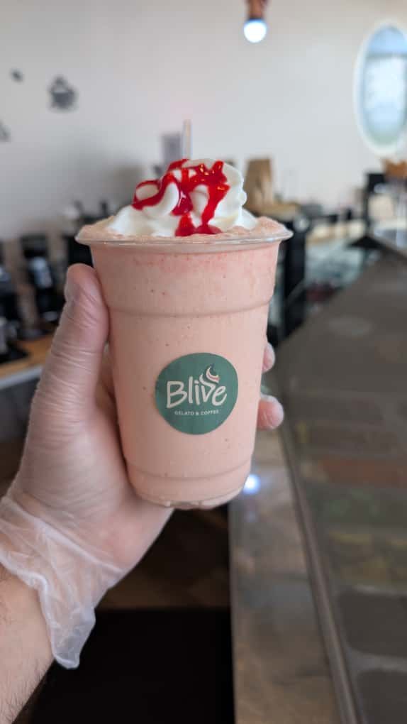 Strawberry shake with whipped cream in a Blive cup